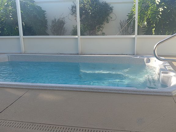 Private swim spa, wall behind