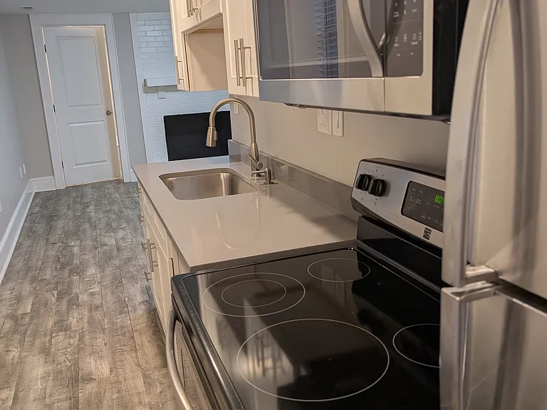 View from end of kitchen facing the main area