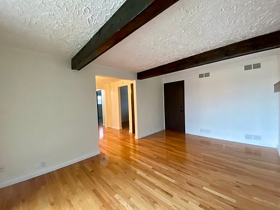 Living room with balcony off of it.