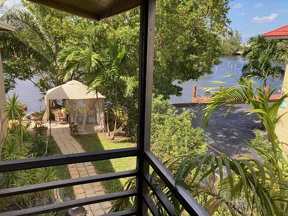 View of River & Riverfront patio from Screened Balcony