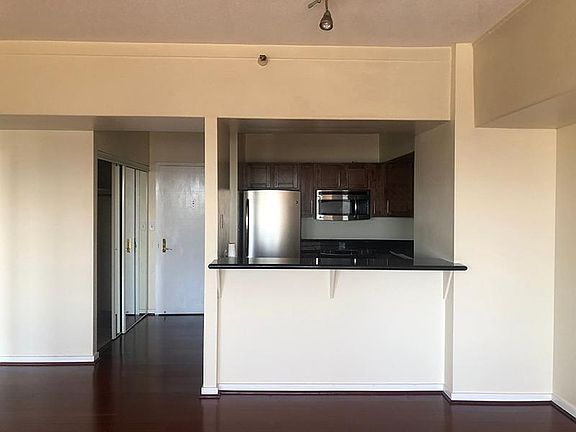 Spacious living room with cherry hardwood floors