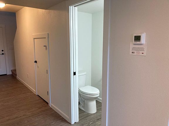 Half bath with pocket door on the first level.