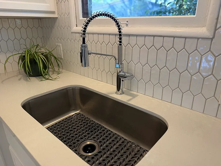 New Stainless steel single basin sink and Kohler faucet.