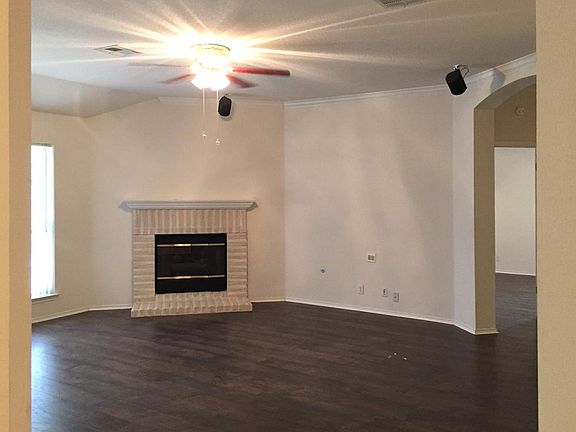 Family area with fireplace and surround sound setup