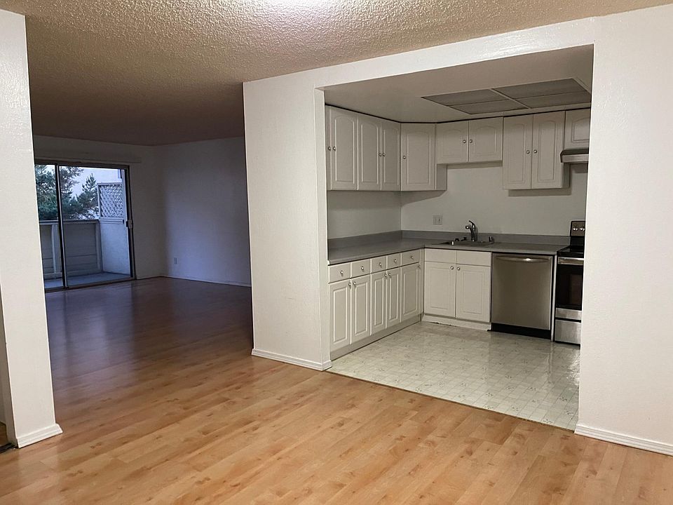 Entrance area, kitchen to right, family room behind.
