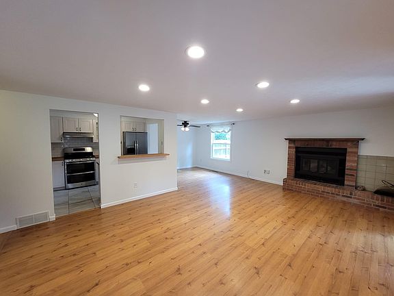 View entering the home. Wood burning fireplace, breakfast nook and open floor plan