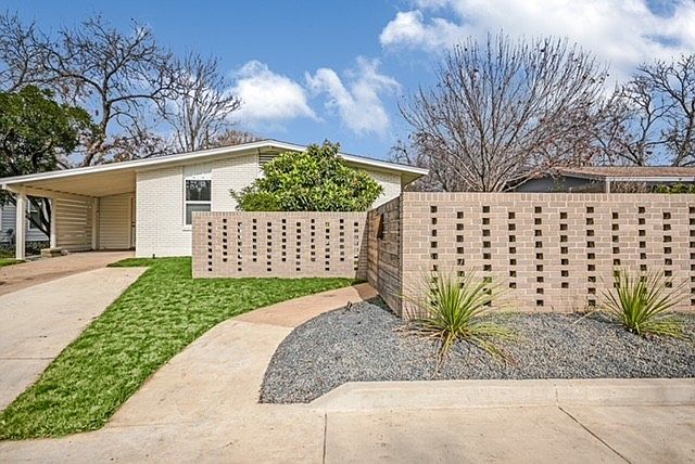 Street view with gated front yard