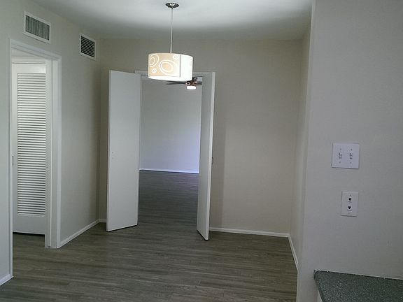 Unique dining/living room space separated by French doors
