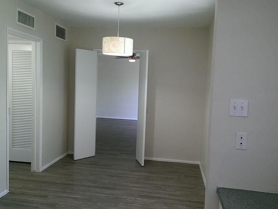 Unique dining/living room space separated by French doors