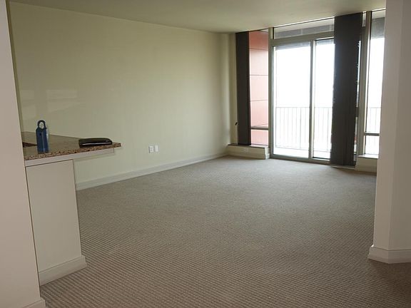 spacious living room with balcony
