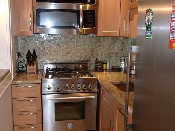 Custom cabinetry, stainless steel, dishwasher and granite co