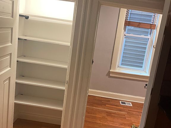 Hardwood floors with pantry and kitchen for extra storage