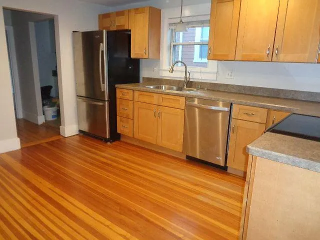 View 2 of the kitchen. To the left there is space for a dining table. To the left of the fridge you can see the entry to the laundry area. Gas dryer/washer hookups (accommodates stackable machines)