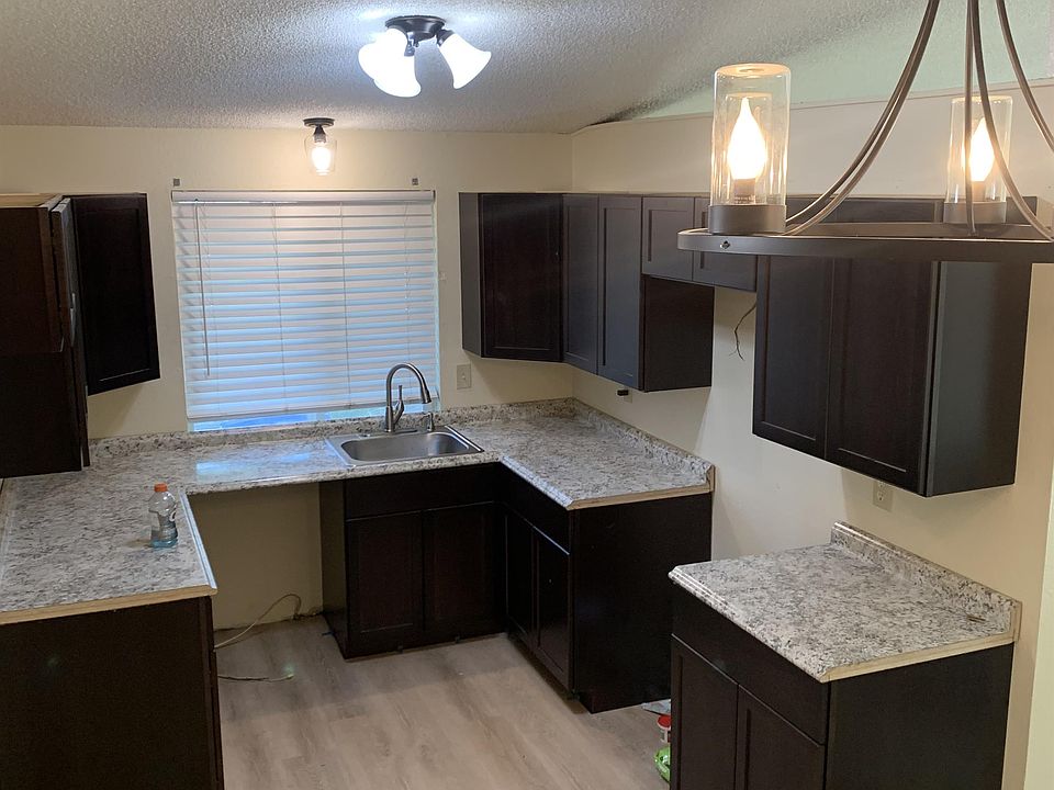 New kitchen cabinets, counters, fixtures and flooring (Appliances not shown, will be installed)