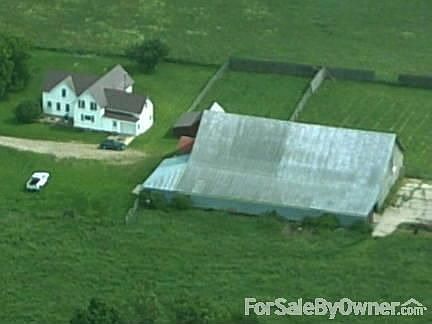 house/barn aerial view : shows paddock, and field