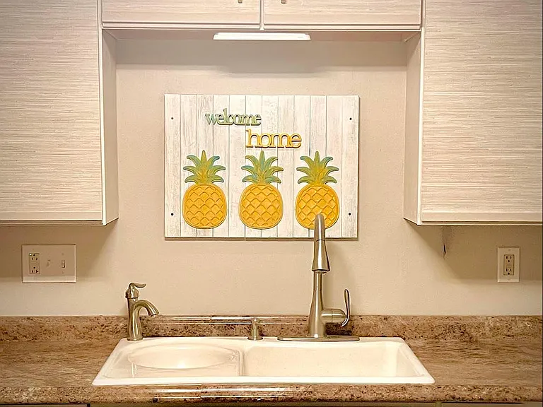 Welcome Home Kitchen. You newly wrapped and painted kitchen cabinets, beautiful matte gold handles.
