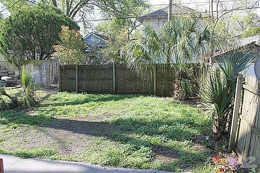 Backyard has a Deck & privacy fencing