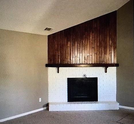 Vaulted ceilings in main living area and fireplace.