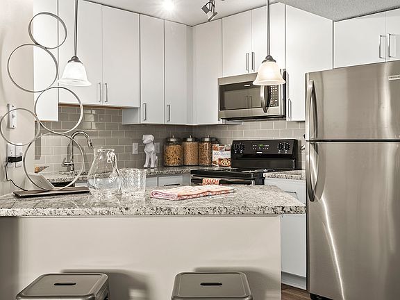 Modern kitchen with sleek finishes and stainless steel appliances