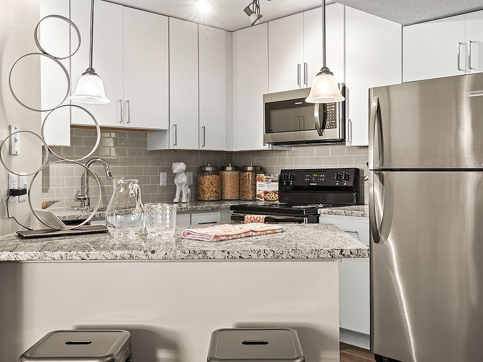 Modern kitchen with sleek finishes and stainless steel appliances