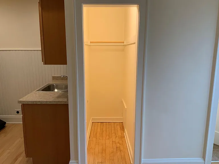 Walk-in closet with large, bright light.