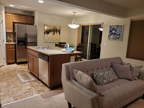 Full Kitchen, pantry, kitchen island. A separate dining area that opens to a patio.