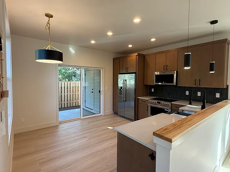 Kitchen with access to back patio.