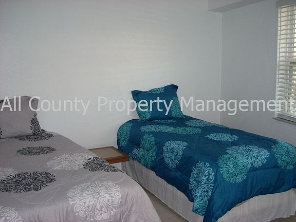 2 twin beds in 2nd bedroom