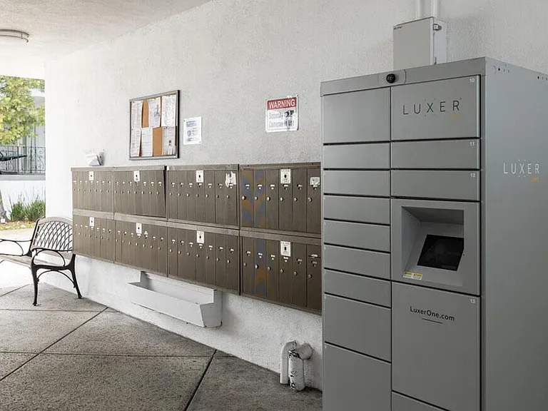 Mail area with Luxer package delivery lockers.