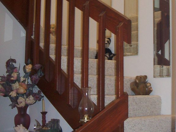 Stairs lead to 2 master suites