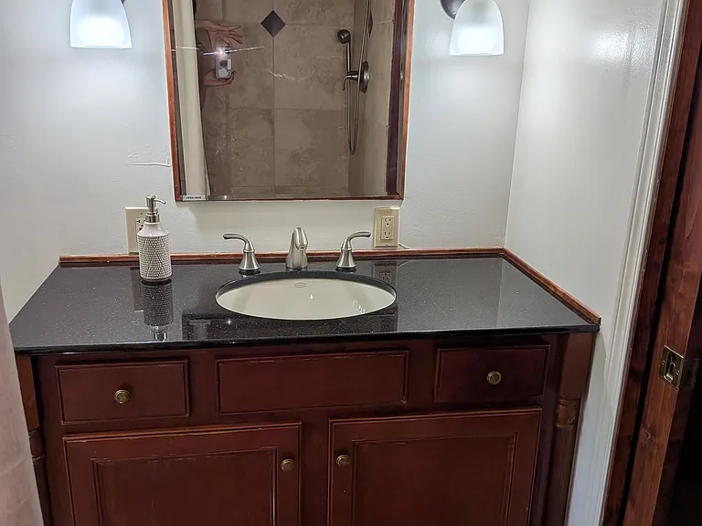 Garden level bathroom in the Suite with shower, heated tiles, closets and its own washer/dryer
