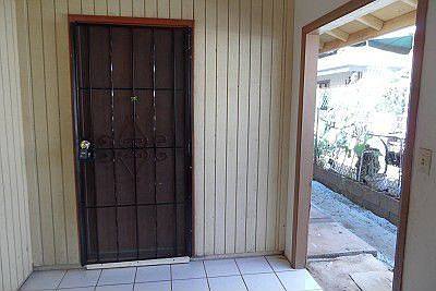 Front door features a security screen door