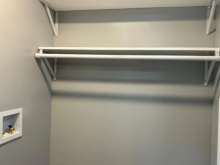 Bathroom storage over washer and dryer hookups