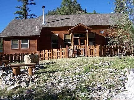 Riverside : Riverside slate patio and fire pit with seating, all well above the floodplain