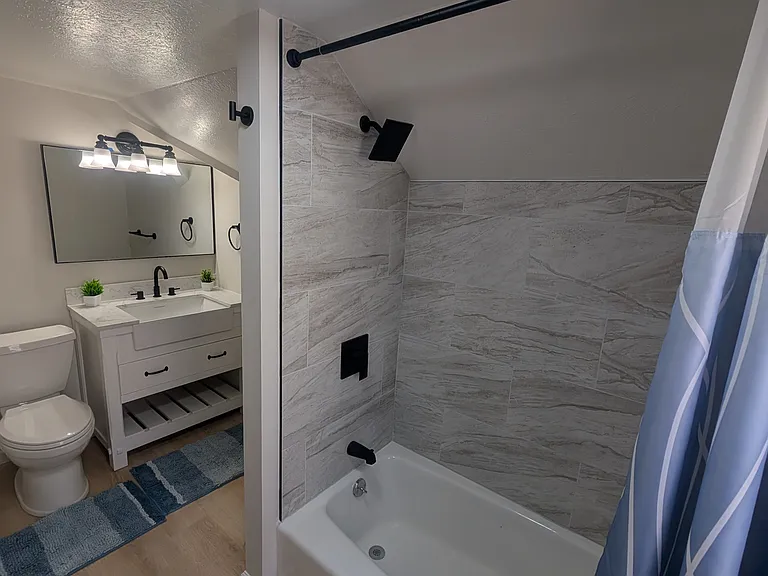 Completely renovated full bathroom on the 2nd floor
12x24 tile tub surround with new mixer valve and black finishes
