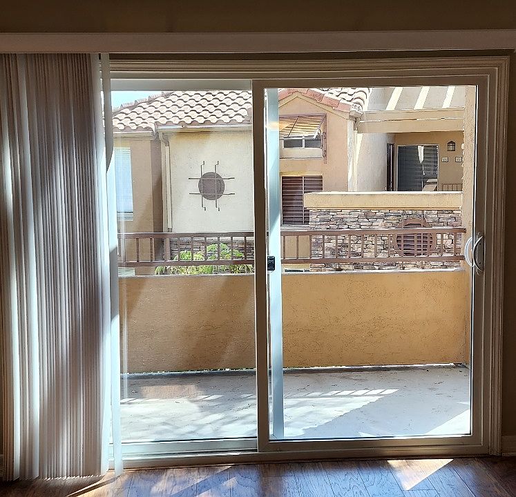 Living Room with Designer Wood Flooring and Patio Access