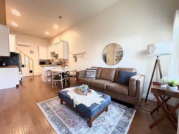 Living room flows into dining and kitchen