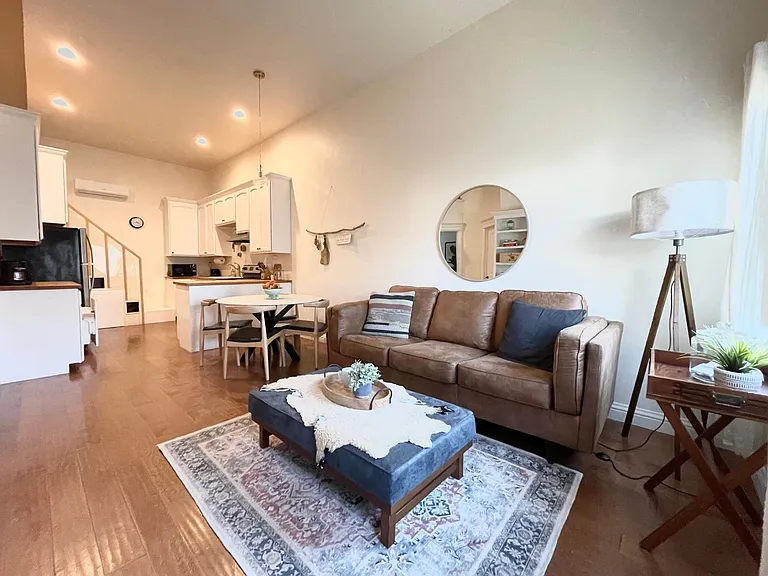 Living room flows into dining and kitchen
