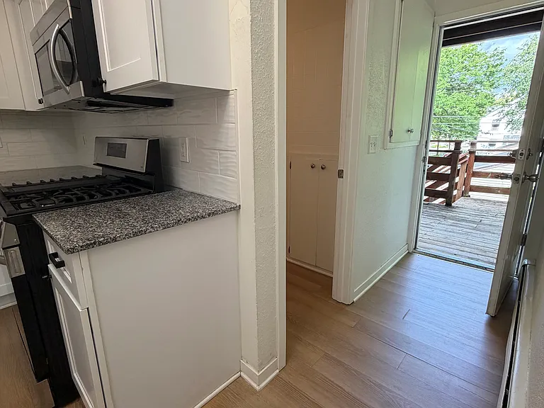 Just off the Kitchen is the back door leading to the deck and the bathroom