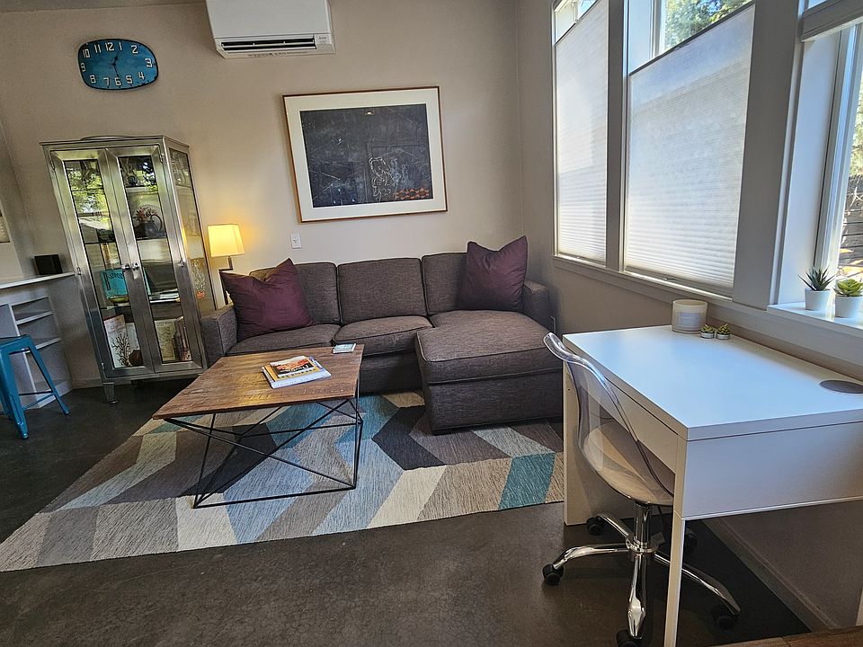 Entry into Living Room. Lots of natural light that you can control with up/down shades.