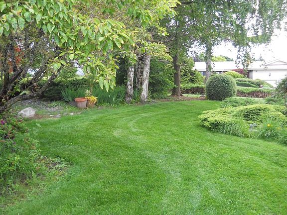 Gracious well landscaped yard with interesting features