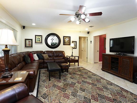 Spacious den with tile flooring. Surround sound in den.
