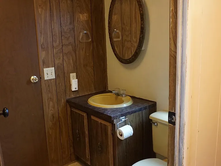 Main bathroom, has tub and shower on the left. Door that is visible leads into bedroom 1. (Bathroom has 2 doors).