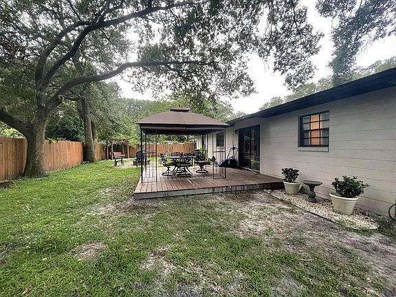 beautiful backyard with fence, deck, plenty rooms for kids or pets.