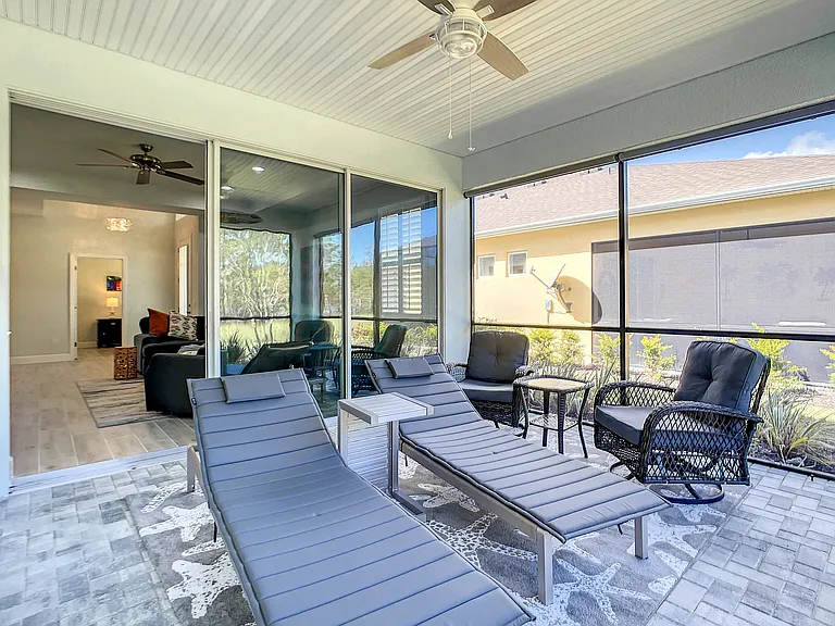 Screened-in Lanai with padded lounge chairs
