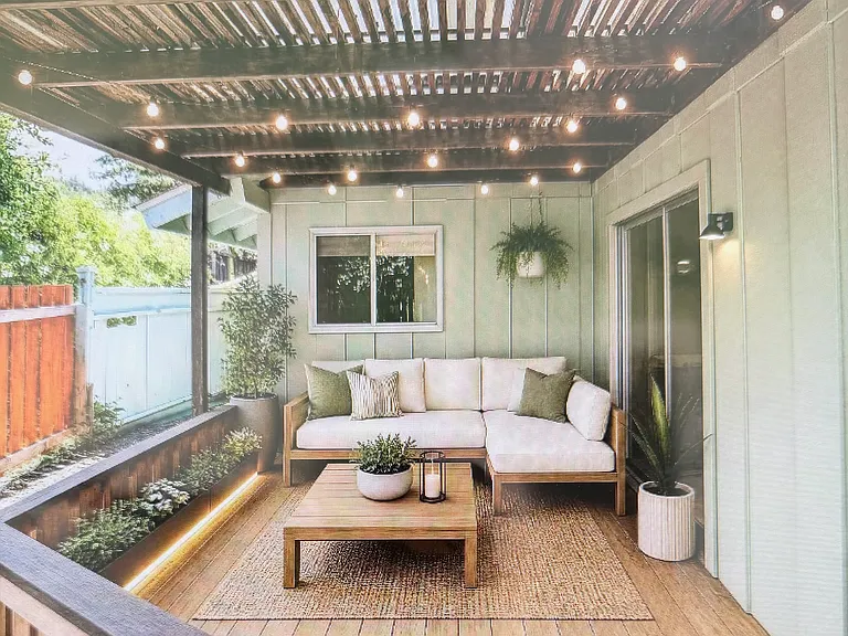 fenced side yard with furniture
