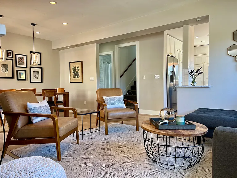 Walk into your open-flow living and dining space. White oak flooring pot lighting.