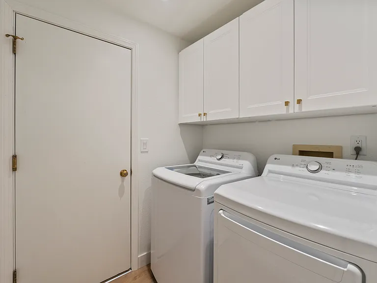 Laundry room off kitchen. Washer and dryer 2 years old