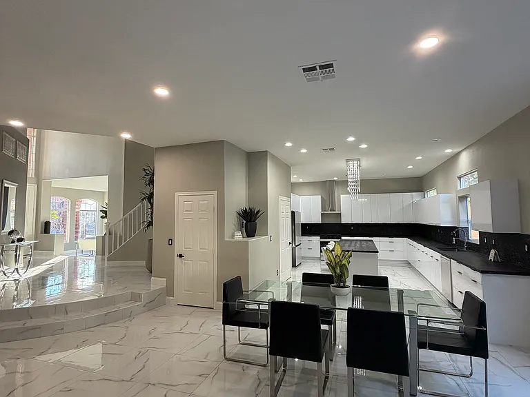 Open dining area connecting seamlessly to th kitchen and main living spaces.