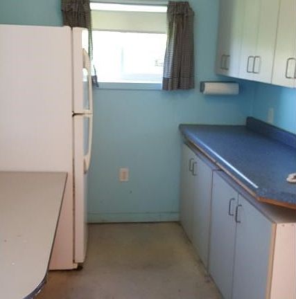 Kitchen with Refrigerator And Counter Workspace